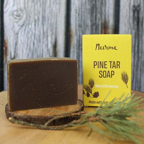 Nurme Pine Tar Soap against a wooden background